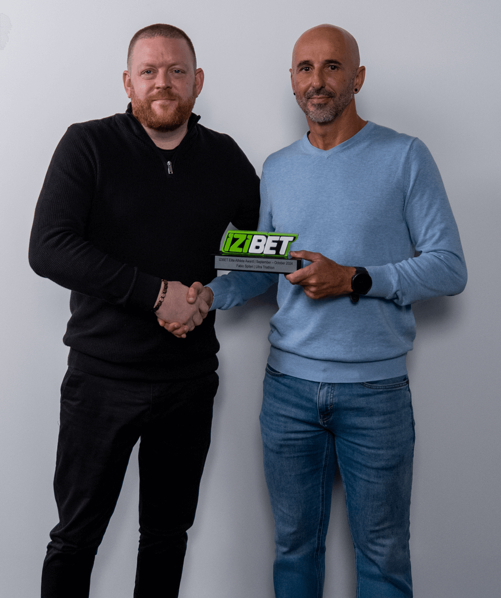 (From left) James Morgan Brand Manager for IZIBET presenting the award to Fabio Spiteri.
