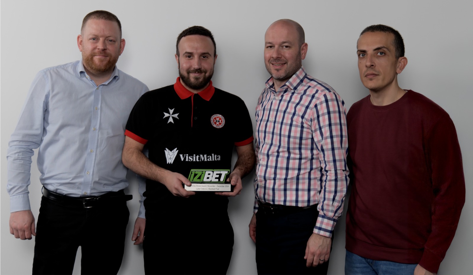 (From left) James Morgan Brand Manager for IZIBET, Lydan Debono, Clinton Buhagiar (President of the Malta Sports Journalists Association) and Stephen Azzopardi (Administrator of the Malta Sports Journalists Association).